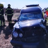 Queda atrapado tras un choque entre una furgoneta y un coche fúnebre en la EX-110