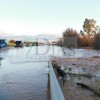 El agua salta por encima de la N-432 tras las fuertes lluvias